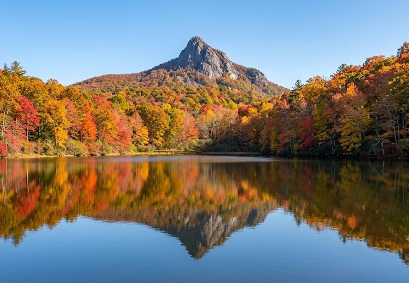 Tranquil mountain lake reflecting the sharp rocky summit of Sharp Top Mountain at Peaks of Otter along the Blue Ridge Parkway