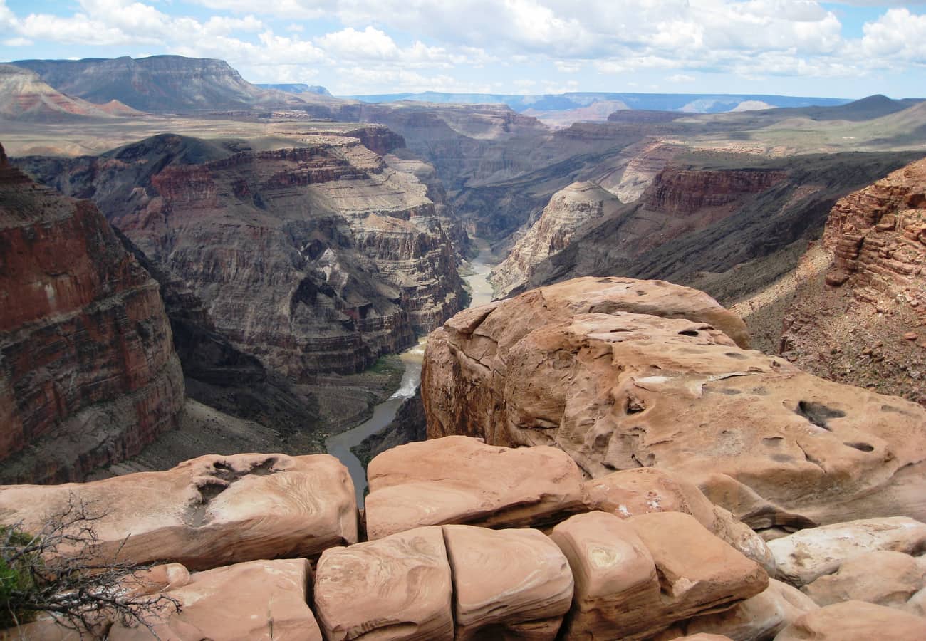 Dizzying vertical 3,000-foot limestone precipice dropping directly to the green Colorado River at Toroweap Overlook