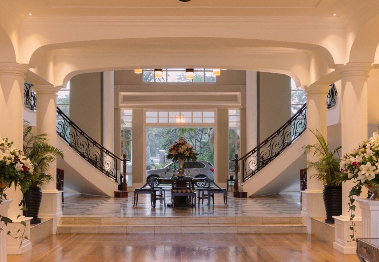 Grand double staircase and marble entrance foyer at Hemingways Nairobi