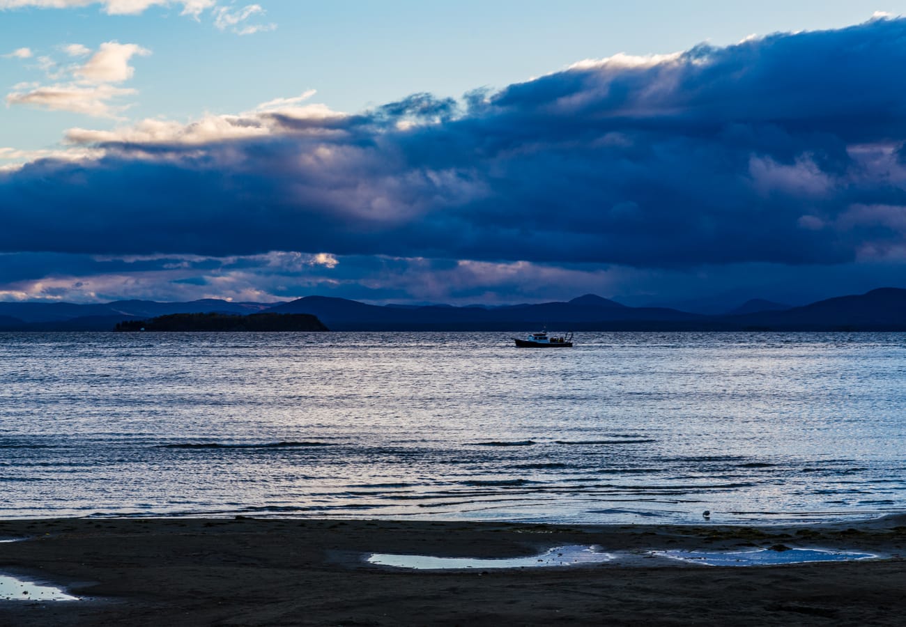 Lake Champlain scenic shoreline and mountain views connecting NY and VT