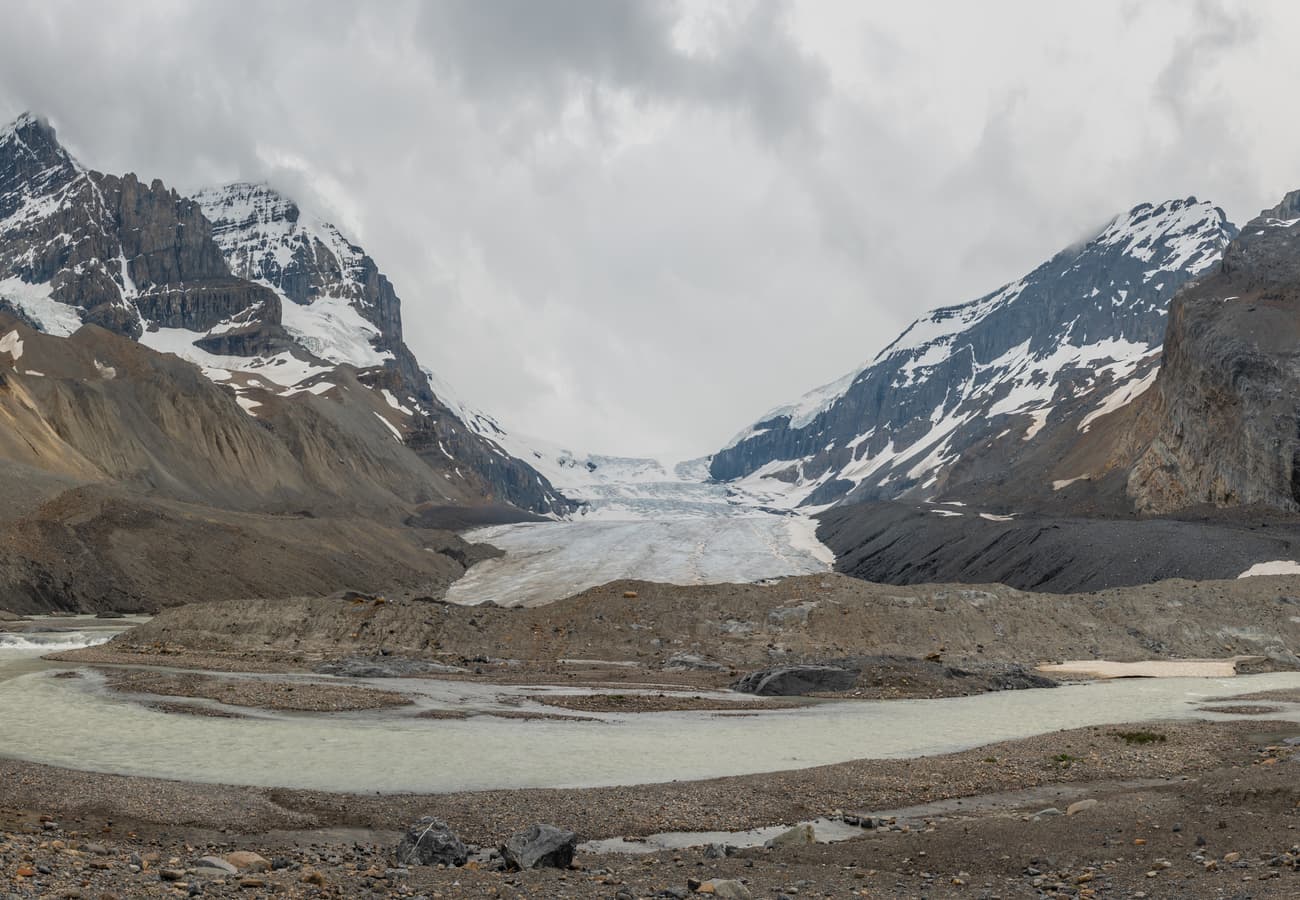 The massive ice tongue of Athabasca Glacier flowing down from the Columbia Icefield into the valley floor