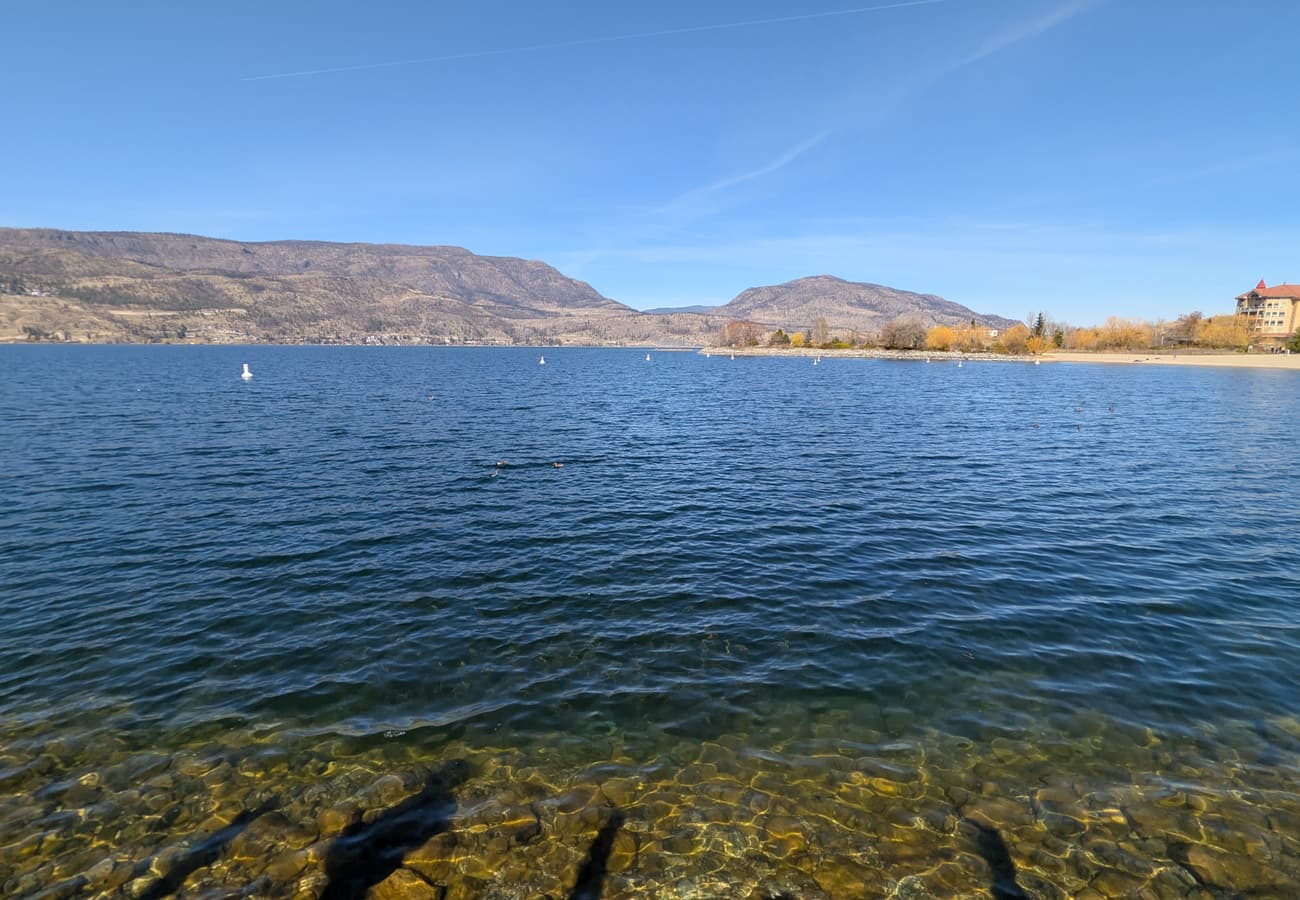 Sun-drenched vineyards and rolling orchards overlooking the deep blue waters of Okanagan Lake in Kelowna