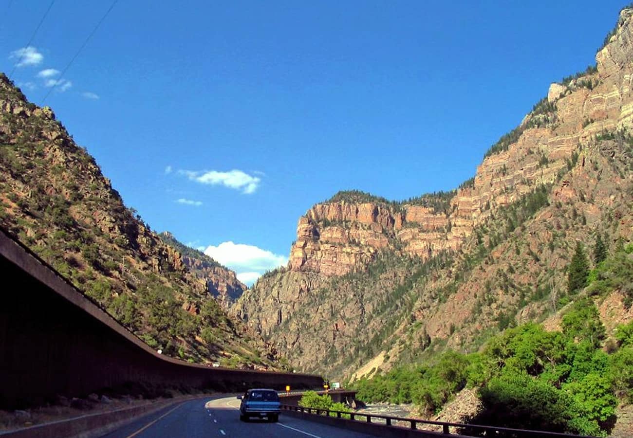 Interstate 70 cantilevered highway viaduct winding through sheer walls in Glenwood Canyon