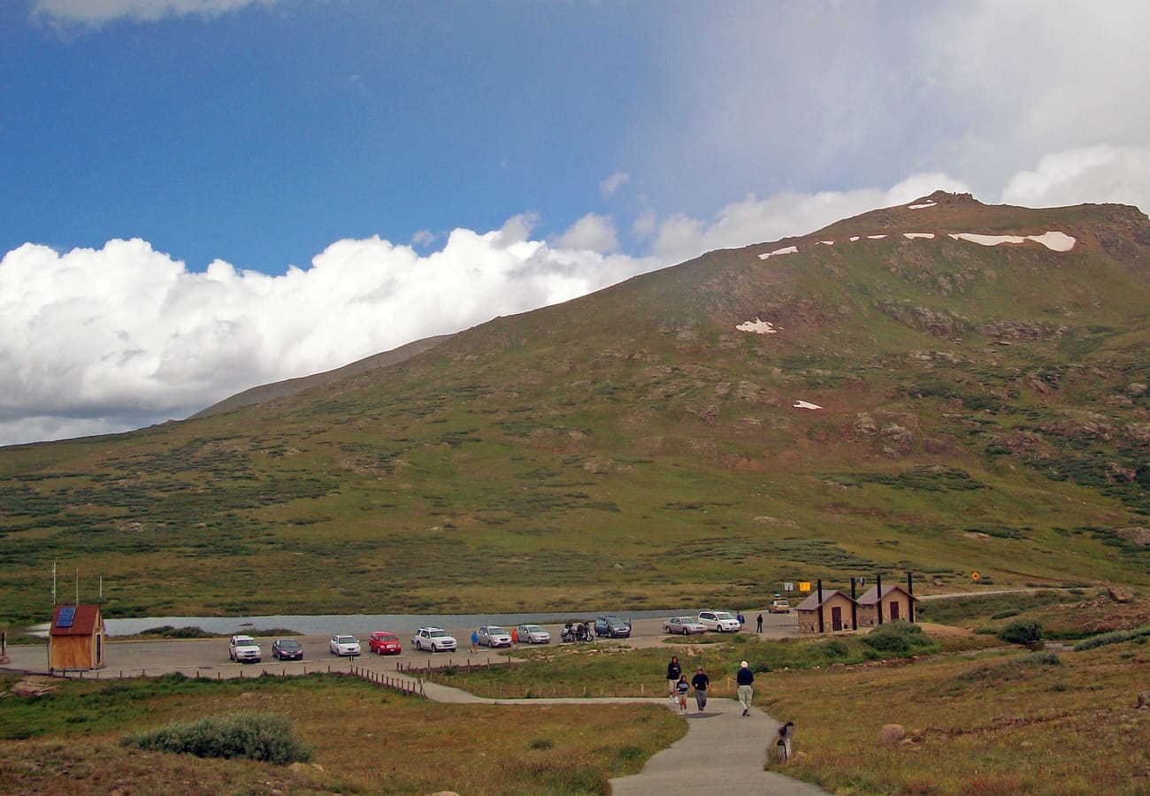 Continental Divide marker and high alpine panorama at the summit of Independence Pass Colorado