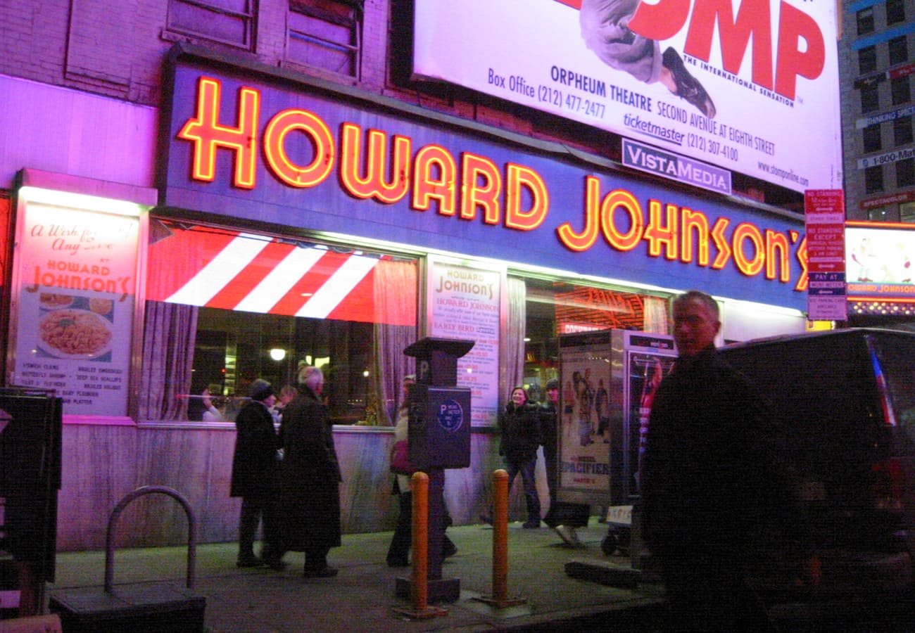 Vintage neon signs and classic architecture in Times Square New York City