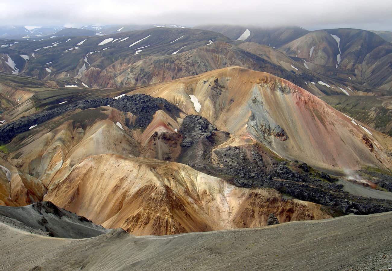 Surreal multi-colored rhyolite mountains and lava fields of Landmannalaugar