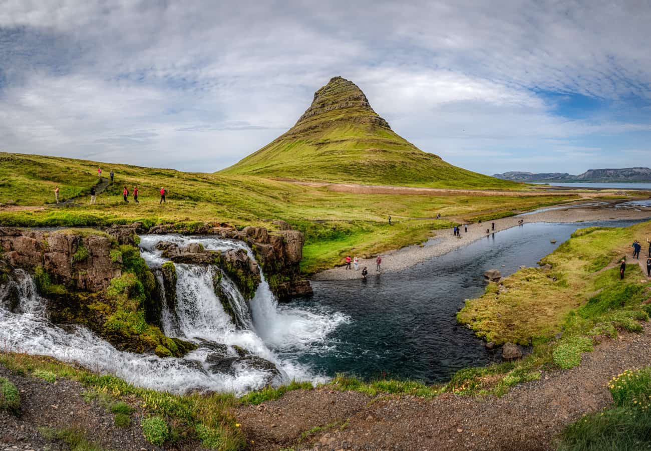 Iconic conical peak of Mount Kirkjufell and waterfalls on the Snæfellsnes Peninsula