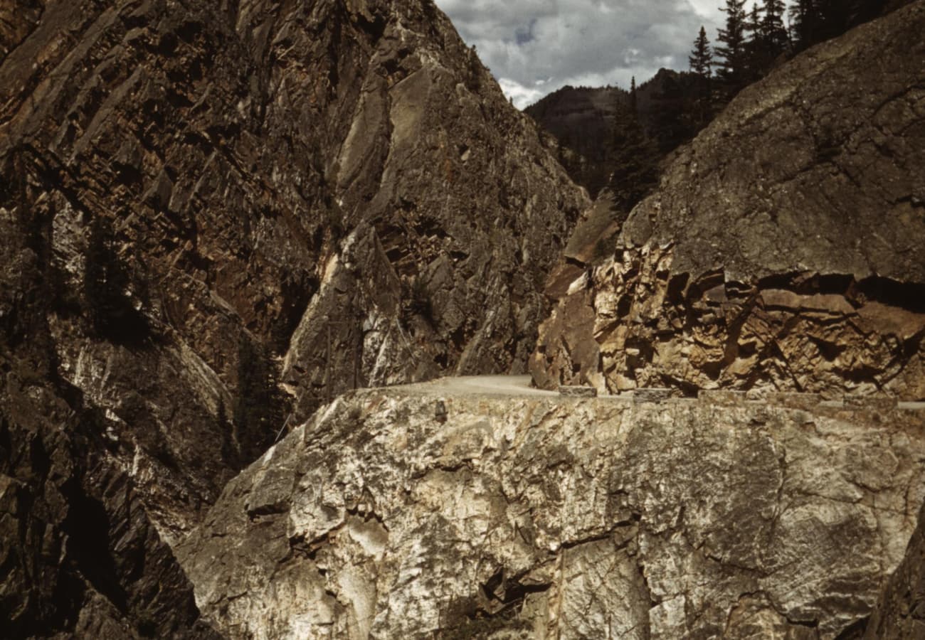 Million Dollar Highway carving through steep mountain cliffs near Ouray Colorado