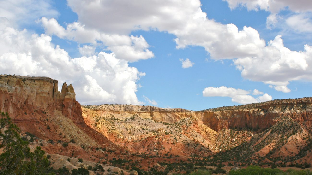 Soaring red and gold sandstone cliffs at Ghost Ranch in Abiquiu New Mexico