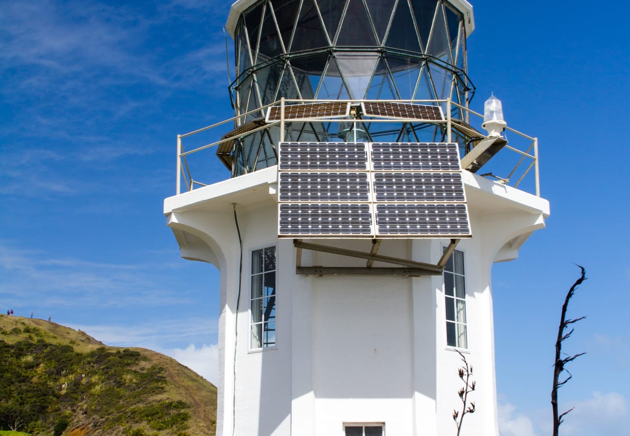 Historic Cape Reinga Lighthouse perched where two oceans collide