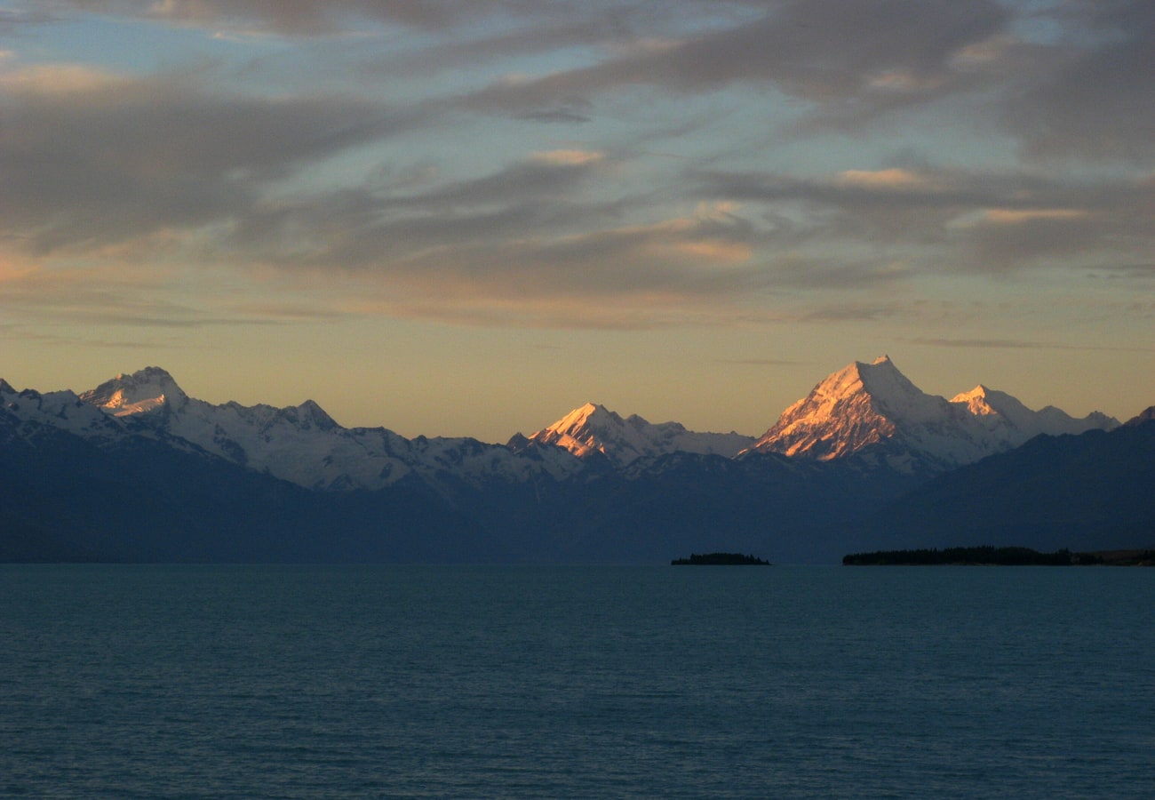Aoraki Mount Cook reflected across the vivid turquoise waters of Lake Pukaki