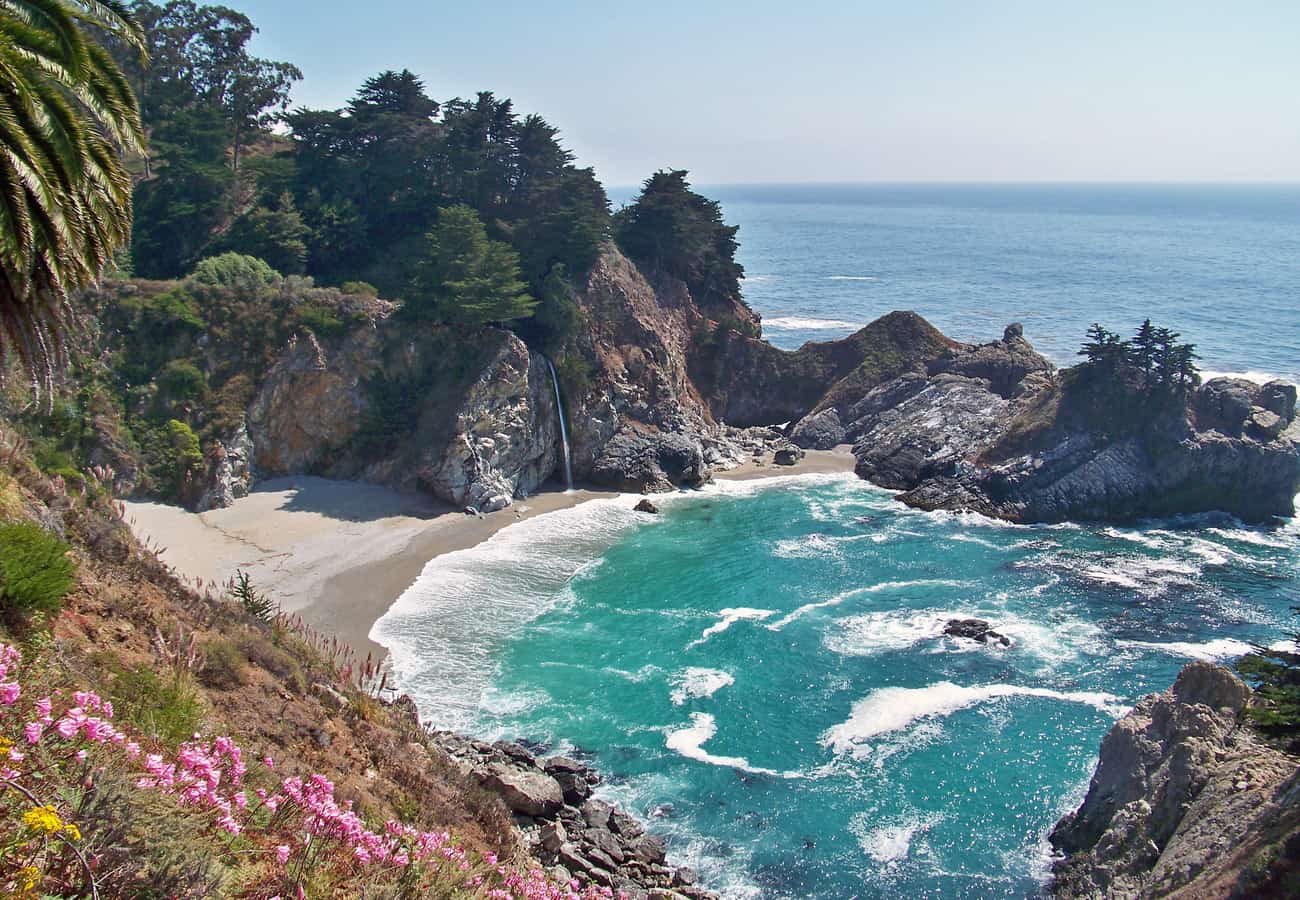 McWay Falls plunging directly onto a pristine cove beach in Big Sur