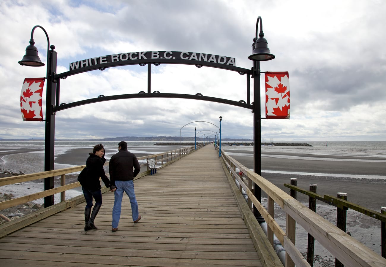 The historic wooden pier in White Rock British Columbia stretching into Semiahmoo Bay
