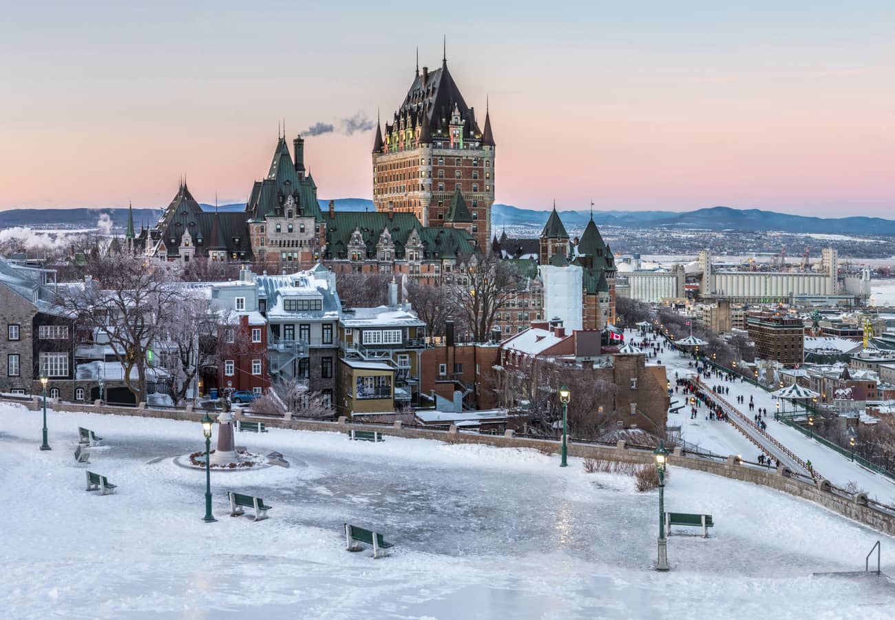 The historic turrets and copper roofs of Fairmont Le Château Frontenac towering over Old Quebec City