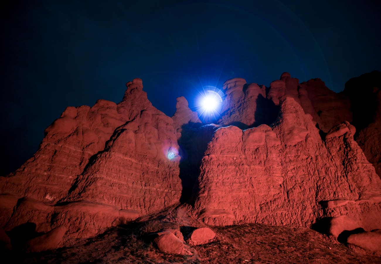 Eerie mushroom-like sandstone goblin formations across the desert basin in Goblin Valley State Park