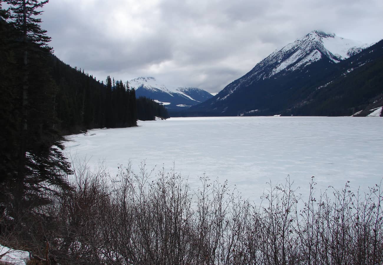 Duffey Lake reflecting alpine peaks along Highway 99 in British Columbia