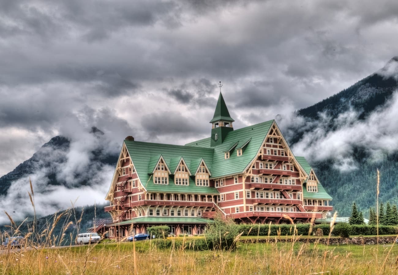 The historic Prince of Wales Hotel perched high on a bluff overlooking Upper Waterton Lake
