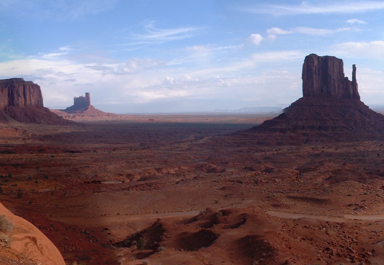 Monument Valley red sandstone buttes rising from desert floor