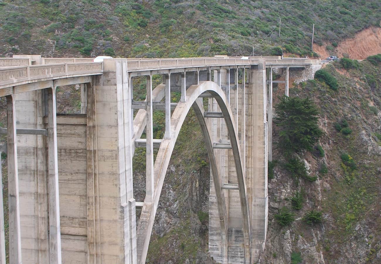 Iconic Bixby Creek Bridge perched high above Pacific surf in Big Sur
