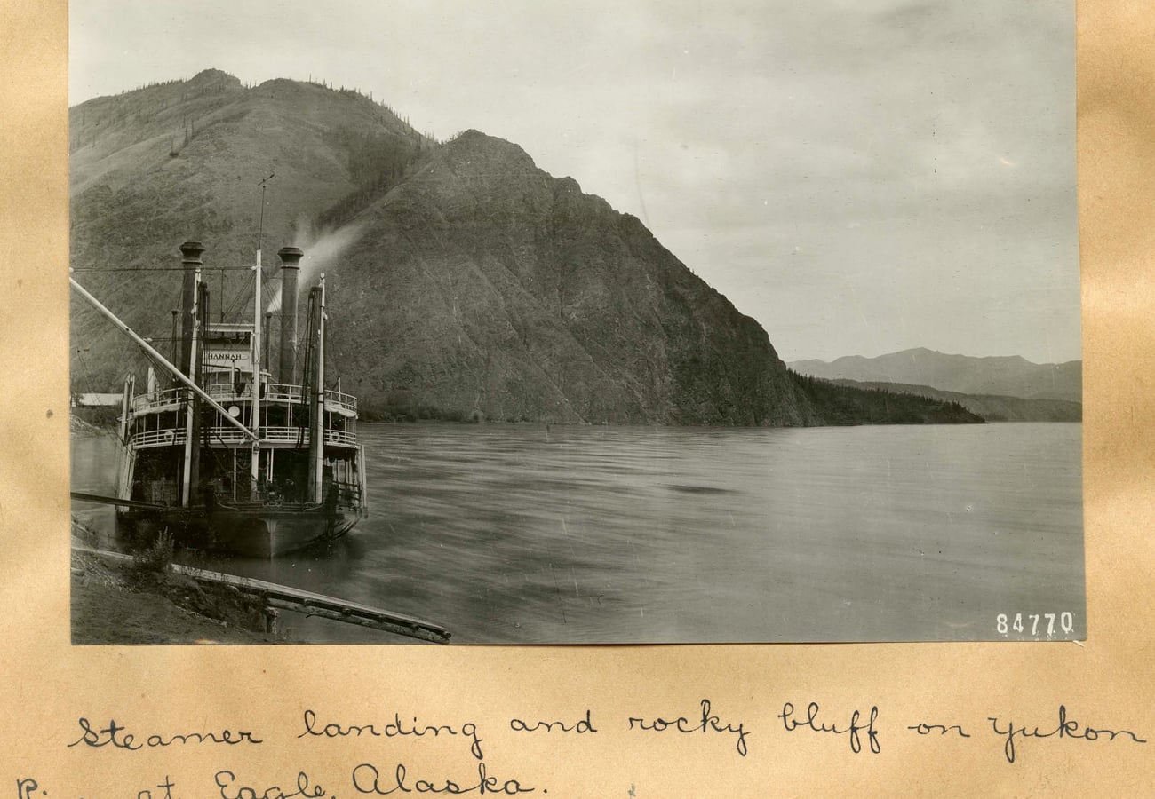 Historic riverboat landing and rocky bluffs on the Yukon River at Eagle Alaska